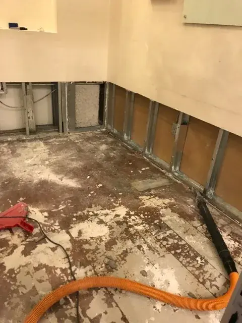 Cabinet opened and dried after an appliance supply-line leak in Santa Clarita